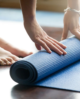 woman with yoga mat