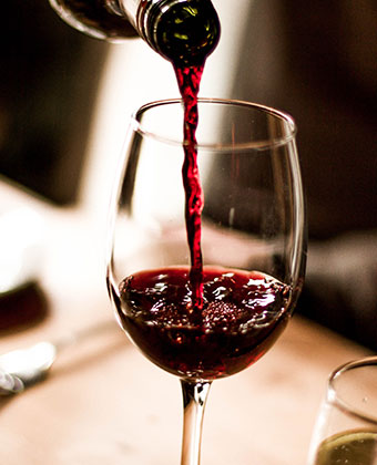 pouring a glass of red wine